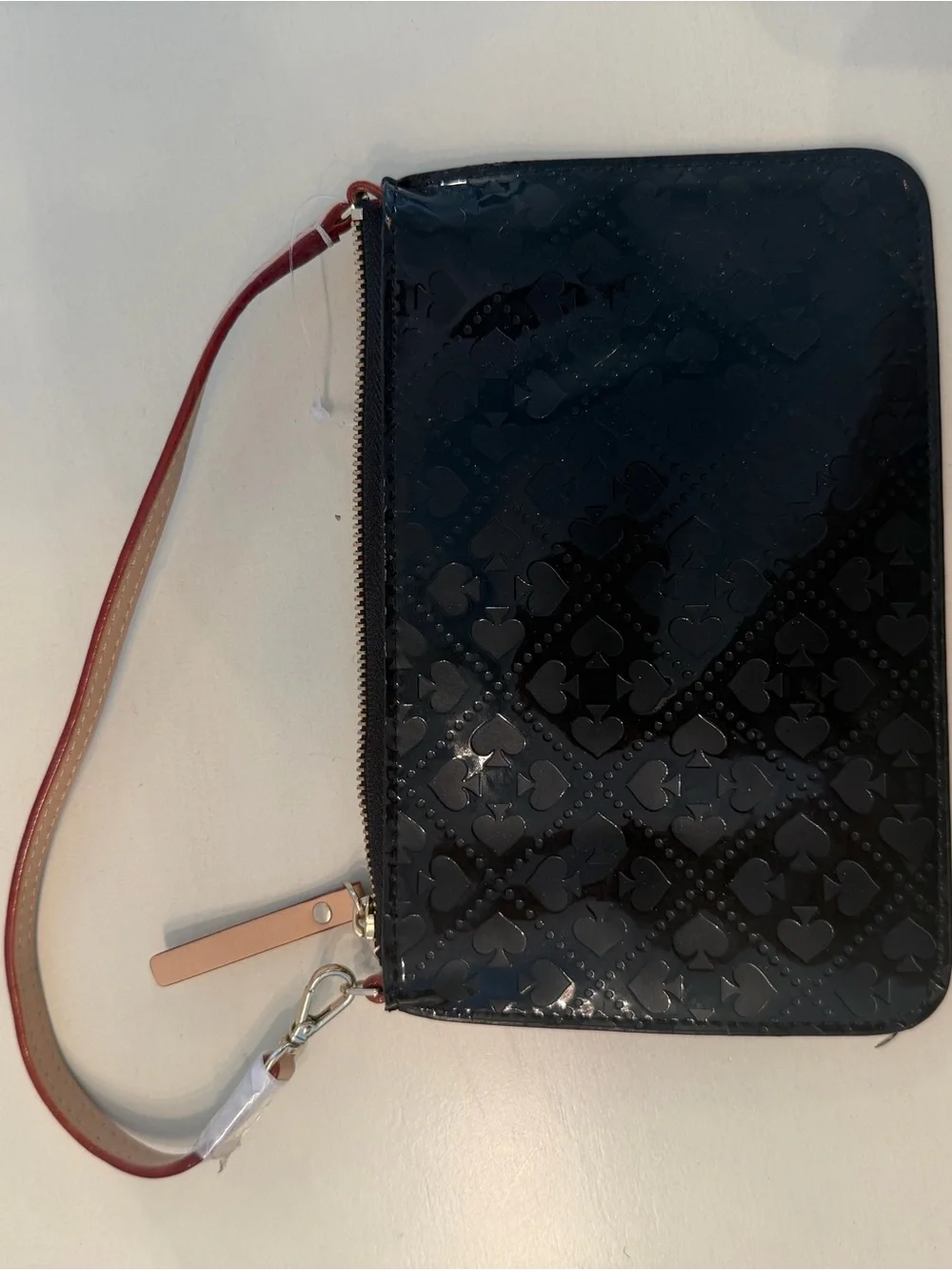 kate spade Black Patent Wristlet with Tan Logo Plaque and Red-Trim Strap